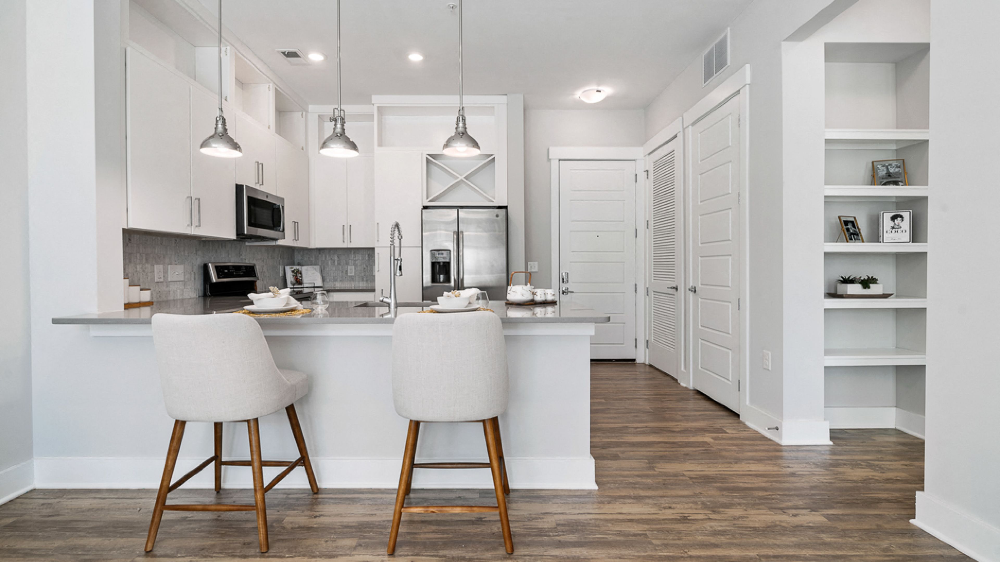 Hawthorne at Friendly apartment interior showing living and dining area with large windows