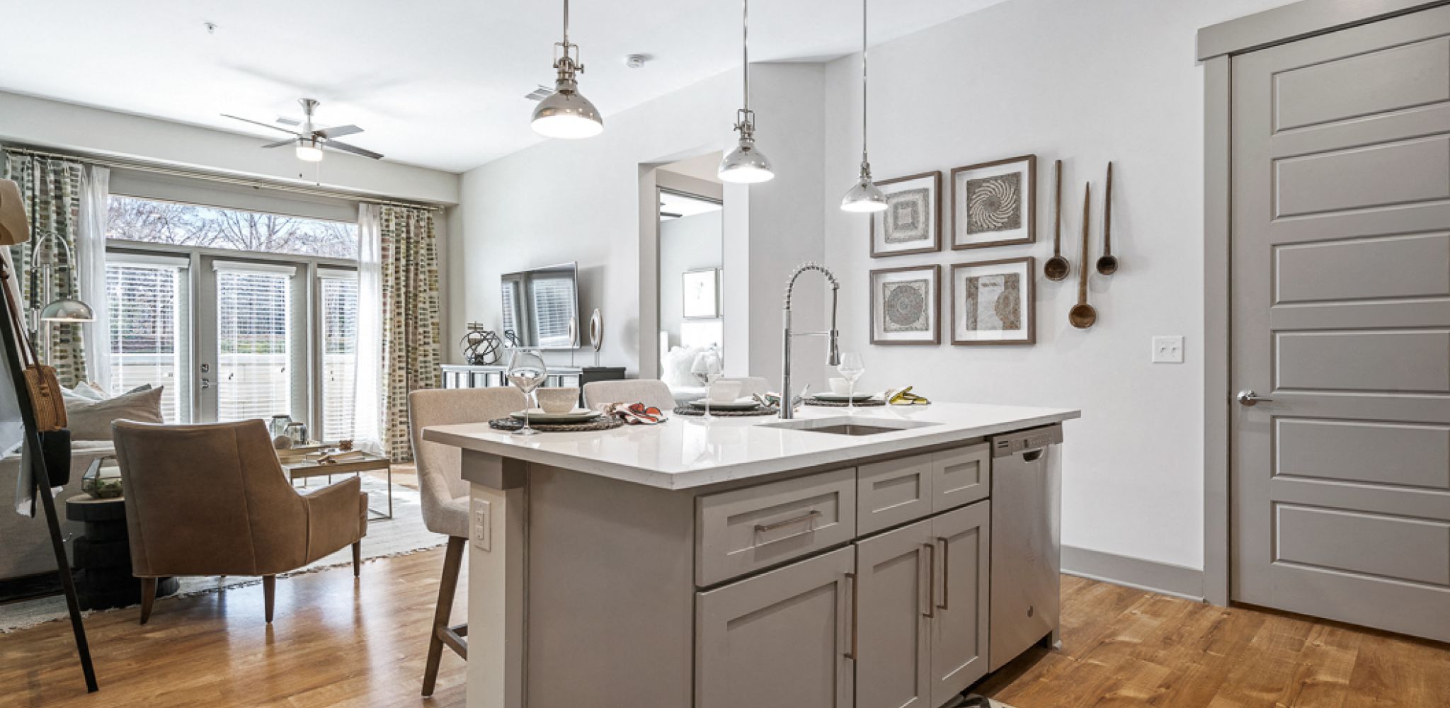 Hawthorne at Friendly apartment kitchen and living space with kitchen island and large patio doors